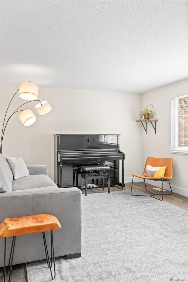 5455 E Iowa Ave, Denver, CO 80222 - living area featuring a textured ceiling and baseboards