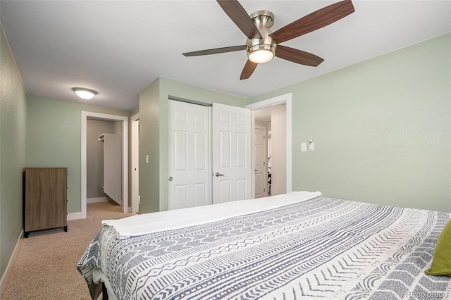 5455 E Iowa Ave, Denver, CO 80222 - bedroom with a closet, light colored carpet, baseboards, and a ceiling fan