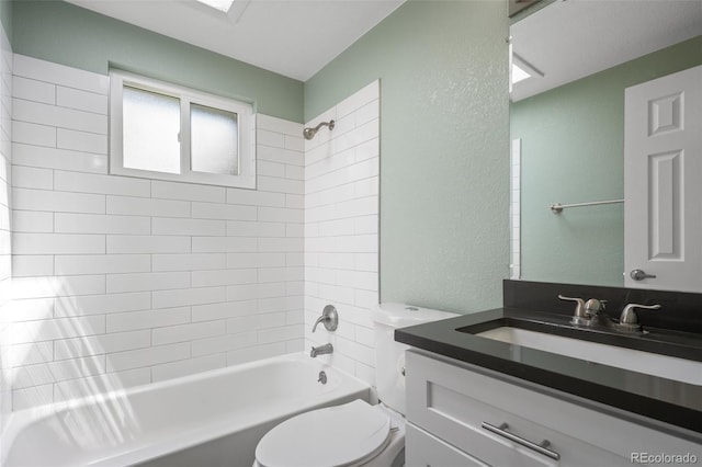 5455 E Iowa Ave, Denver, CO 80222 - full bath featuring toilet, shower / tub combination, vanity, and a textured wall
