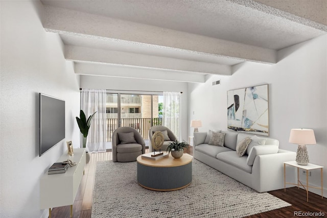 living room with beam ceiling, wood-type flooring, and a textured ceiling