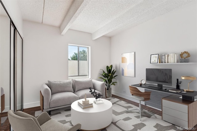 living room featuring beam ceiling, a textured ceiling, and light hardwood / wood-style floors