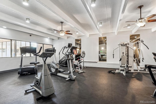 workout area with ceiling fan and a textured ceiling