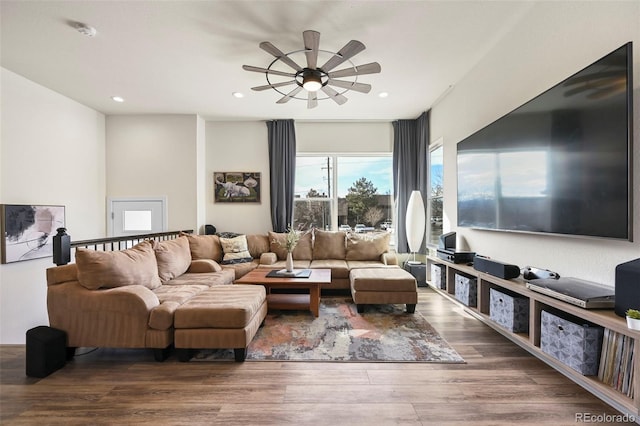 living area with recessed lighting, ceiling fan, and wood finished floors