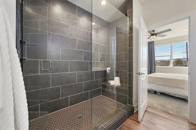 ensuite bathroom featuring recessed lighting, ensuite bathroom, a stall shower, ceiling fan, and wood finished floors