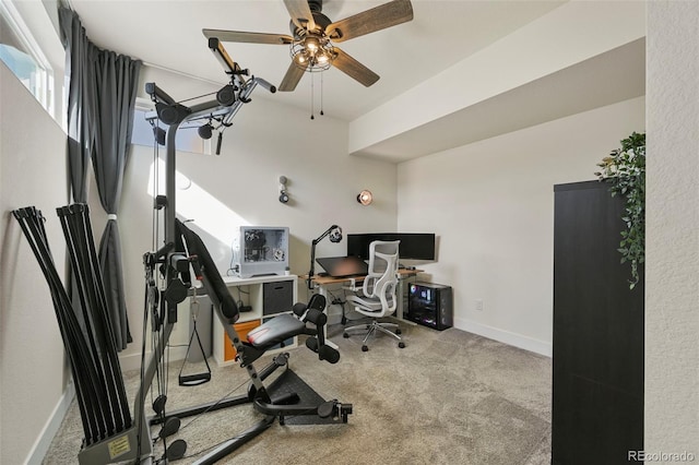 workout room featuring carpet floors, baseboards, and a ceiling fan