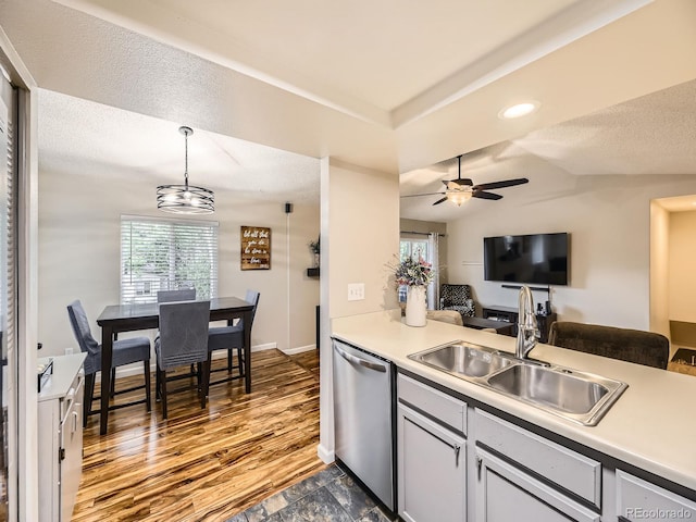 2104 Vineyard Dr, Castle Rock, CO 80104 - kitchen featuring dishwasher, open floor plan, hanging light fixtures, light countertops, and a textured ceiling