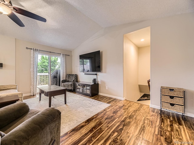 2104 Vineyard Dr, Castle Rock, CO 80104 - living area featuring wood finished floors, a textured ceiling, a ceiling fan, and vaulted ceiling