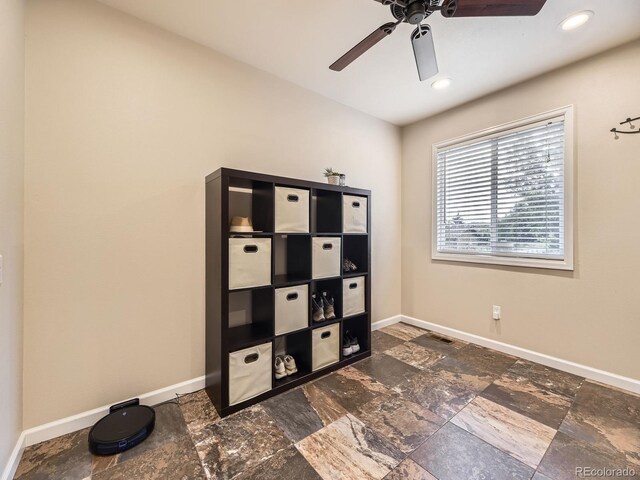 2104 Vineyard Dr, Castle Rock, CO 80104 - unfurnished bedroom featuring stone tile flooring, ceiling fan, and recessed lighting