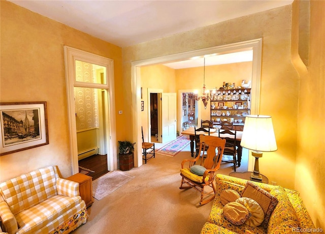 808 Rose St, Georgetown, CO 80444 - living area featuring a baseboard radiator, a chandelier, and carpet