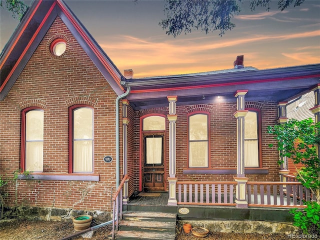 808 Rose St, Georgetown, CO 80444 - view of front of property featuring brick siding and covered porch