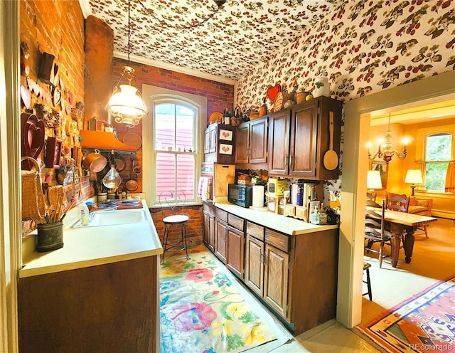 808 Rose St, Georgetown, CO 80444 - kitchen with healthy amount of natural light, black microwave, light countertops, and pendant lighting
