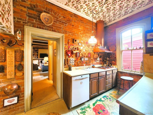 808 Rose St, Georgetown, CO 80444 - kitchen with white dishwasher, light countertops, hanging light fixtures, and brick wall