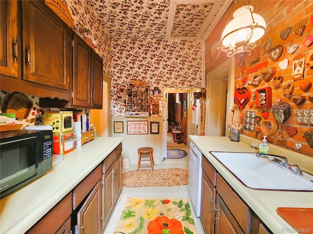 808 Rose St, Georgetown, CO 80444 - kitchen featuring wallpapered walls, black microwave, light countertops, white dishwasher, and light wood-style floors