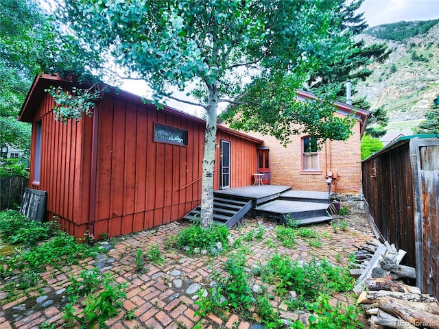808 Rose St, Georgetown, CO 80444 - view of side of property featuring board and batten siding and a deck with mountain view
