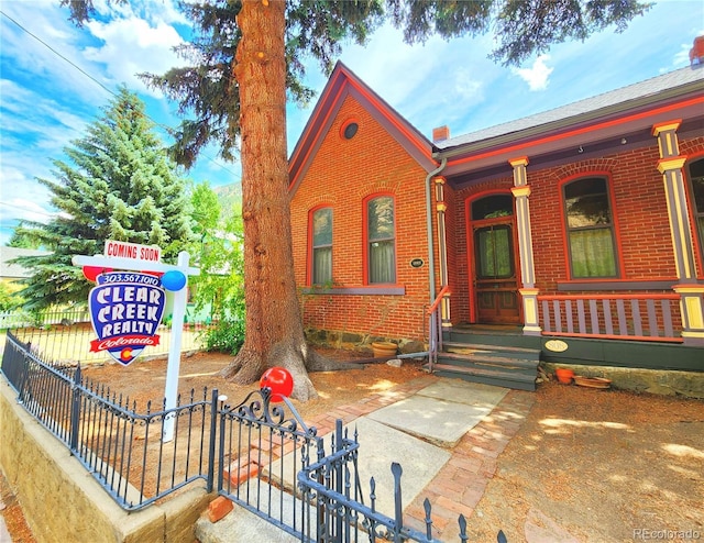 808 Rose St, Georgetown, CO 80444 - view of front of property featuring brick siding and covered porch