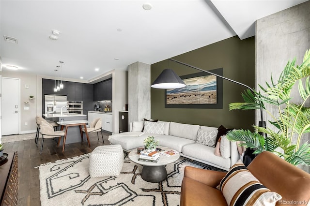 4200 W 17th Ave Unit 212, Denver, CO 80204 - living area with dark wood-style flooring and baseboards