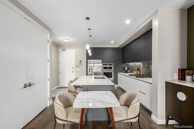 4200 W 17th Ave Unit 212, Denver, CO 80204 - dining space with dark wood finished floors and recessed lighting