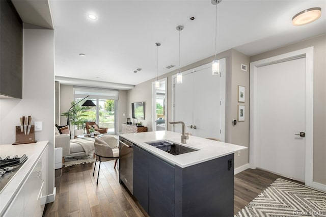 4200 W 17th Ave Unit 212, Denver, CO 80204 - kitchen featuring stainless steel dishwasher, light countertops, dark wood-style flooring, and modern cabinets