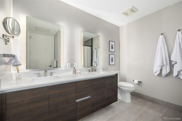 4200 W 17th Ave Unit 212, Denver, CO 80204 - full bath with double vanity and tile patterned floors