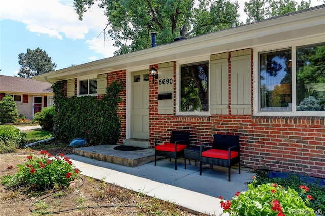 5690 E Cornell Ave, Denver, CO 80222 - view of front of house featuring brick siding