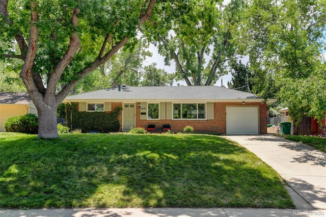 5690 E Cornell Ave, Denver, CO 80222 - single story home with an attached garage, driveway, and brick siding