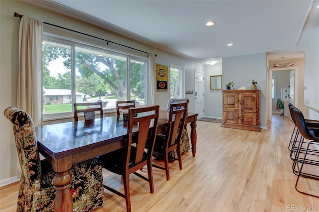 5690 E Cornell Ave, Denver, CO 80222 - dining space with light wood-style floors and recessed lighting