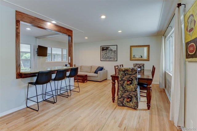 5690 E Cornell Ave, Denver, CO 80222 - dining area featuring light wood finished floors and recessed lighting