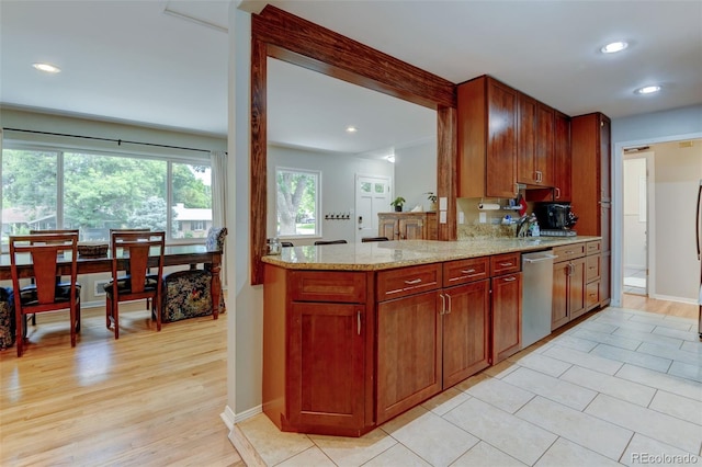 5690 E Cornell Ave, Denver, CO 80222 - kitchen featuring stainless steel dishwasher, recessed lighting, light stone counters, light wood finished floors, and a peninsula