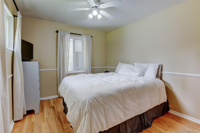 5690 E Cornell Ave, Denver, CO 80222 - bedroom featuring light wood-style floors and a ceiling fan