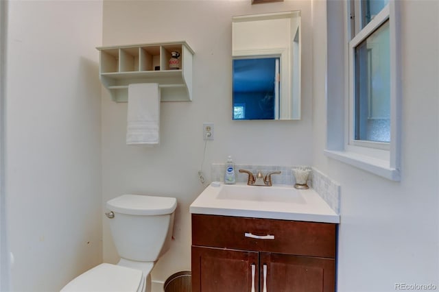 5690 E Cornell Ave, Denver, CO 80222 - half bath featuring toilet and vanity