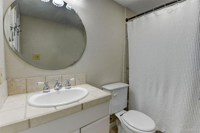 5690 E Cornell Ave, Denver, CO 80222 - full bathroom with vanity and a shower with shower curtain