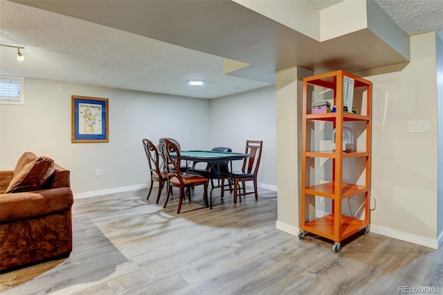 5690 E Cornell Ave, Denver, CO 80222 - dining room with wood finished floors and a textured ceiling