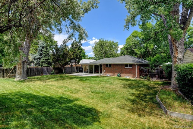 5690 E Cornell Ave, Denver, CO 80222 - fenced backyard featuring a patio