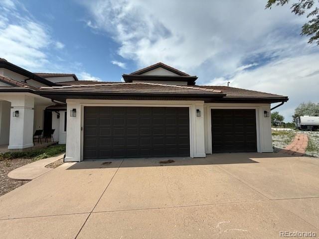 1545 W 148th Ave, Westminster, CO 80023 - garage featuring driveway