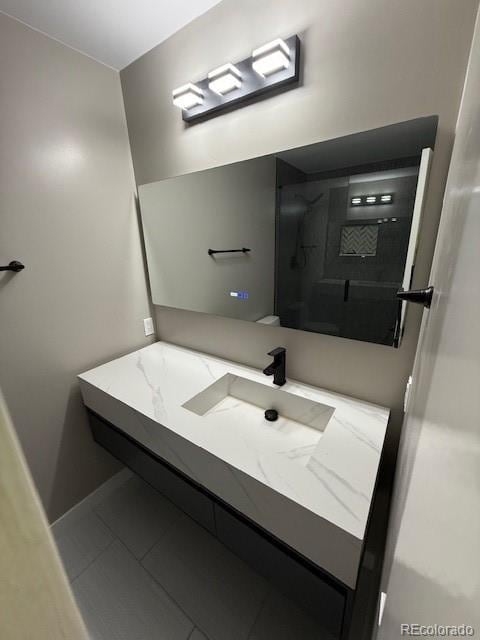 1545 W 148th Ave, Westminster, CO 80023 - bathroom featuring vanity, a shower, and tile patterned flooring