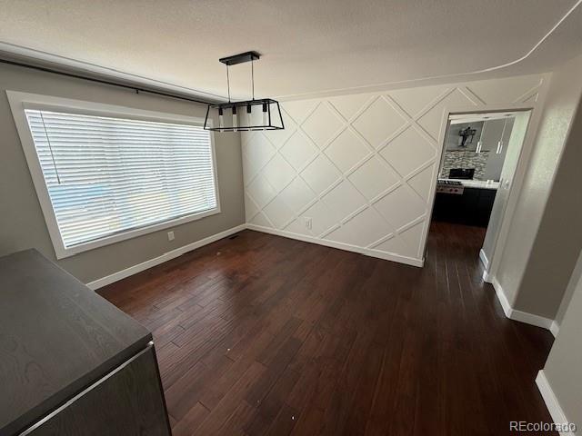 1545 W 148th Ave, Westminster, CO 80023 - unfurnished dining area featuring dark wood-type flooring