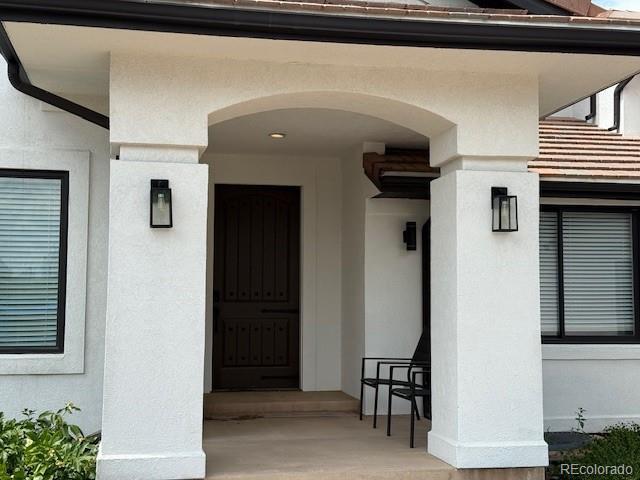 1545 W 148th Ave, Westminster, CO 80023 - property entrance with stucco siding