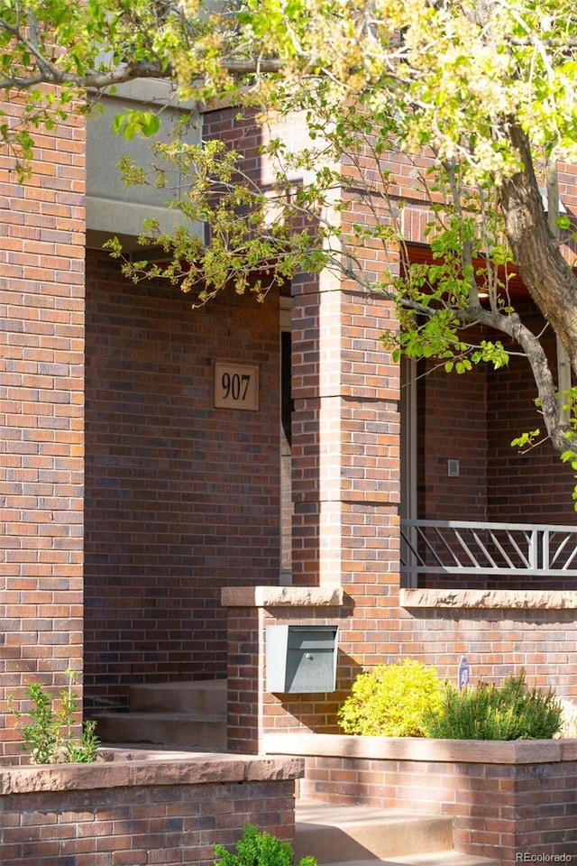907 E 22nd Ave, Denver, CO 80205 - property entrance with brick siding