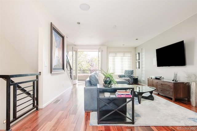 907 E 22nd Ave, Denver, CO 80205 - living area featuring light wood finished floors and baseboards