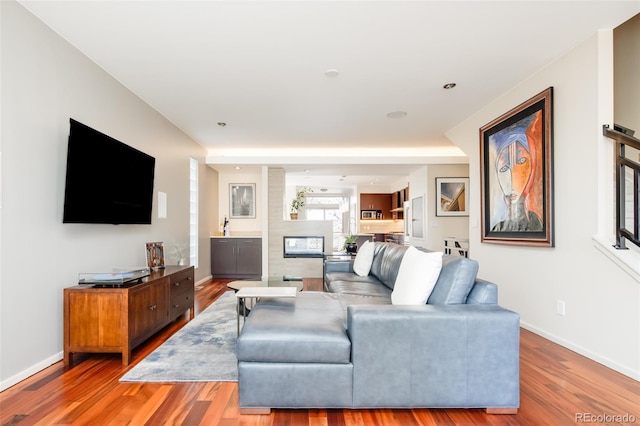 907 E 22nd Ave, Denver, CO 80205 - living room with light wood finished floors