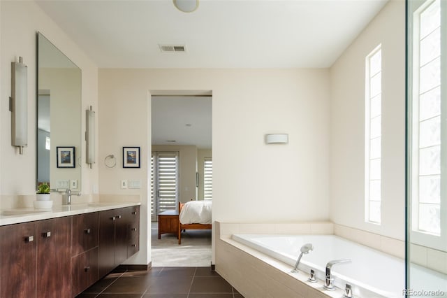 907 E 22nd Ave, Denver, CO 80205 - ensuite bathroom with vanity, plenty of natural light, and a garden tub