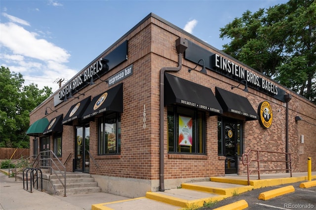 907 E 22nd Ave, Denver, CO 80205 - view of building exterior with uncovered parking