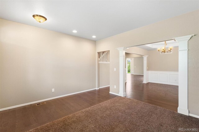 1339 Sidewinder Cir, Castle Rock, CO 80108 - unfurnished room featuring decorative columns, a chandelier, recessed lighting, carpet floors, and wood finished floors