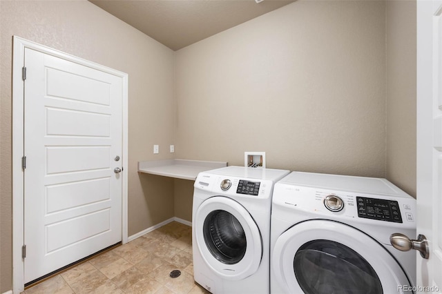 1339 Sidewinder Cir, Castle Rock, CO 80108 - washroom featuring washing machine and clothes dryer and baseboards