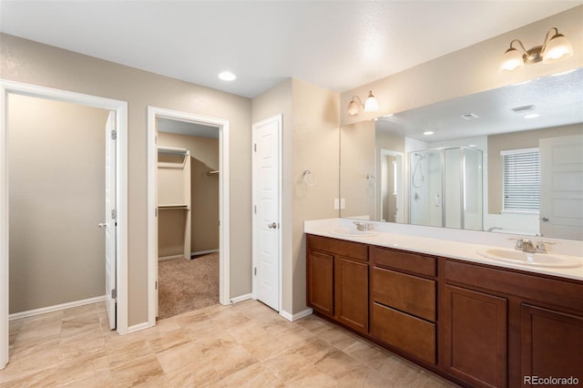 1339 Sidewinder Cir, Castle Rock, CO 80108 - full bathroom with a shower stall, double vanity, and a walk in closet