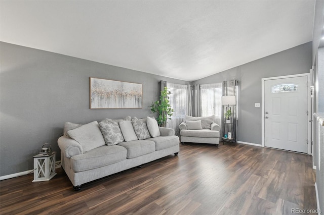 living room with dark hardwood / wood-style flooring and lofted ceiling