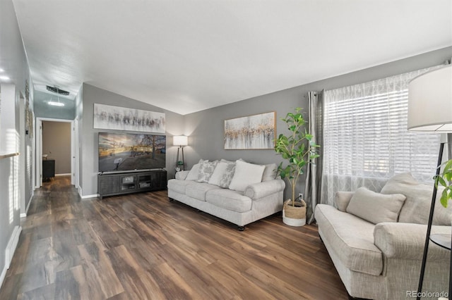 living room with vaulted ceiling and dark hardwood / wood-style floors