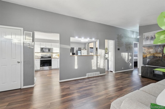 living room featuring dark hardwood / wood-style floors