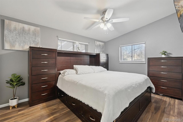 bedroom featuring ceiling fan, lofted ceiling, and dark hardwood / wood-style floors