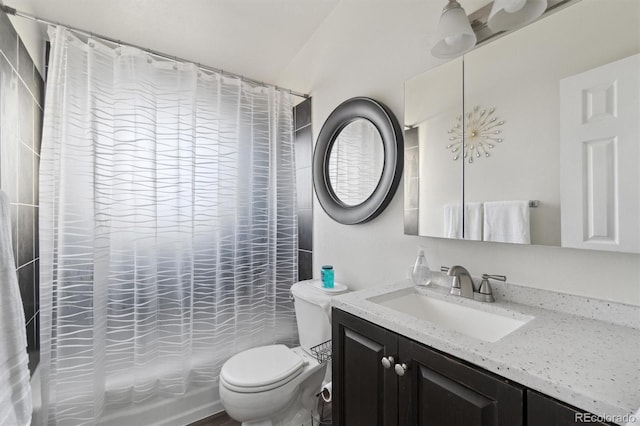 full bathroom with toilet, vanity, and shower / bath combo with shower curtain